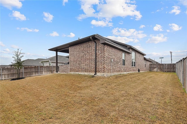 view of home's exterior with a yard