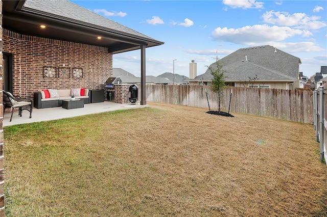 view of yard with an outdoor hangout area, a patio, and exterior kitchen