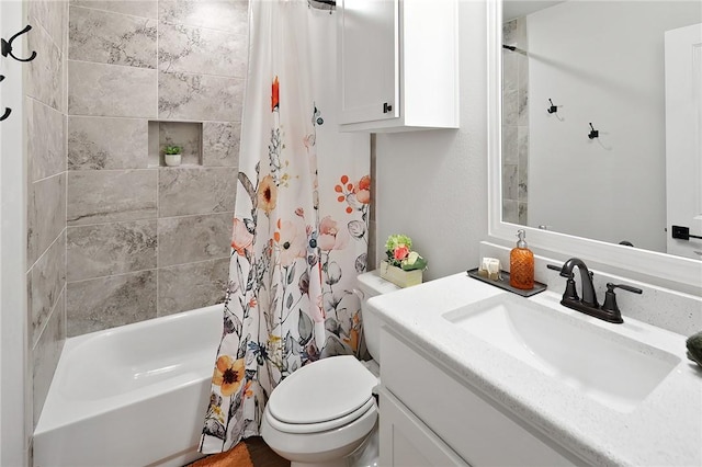 full bathroom featuring shower / tub combo with curtain, vanity, and toilet