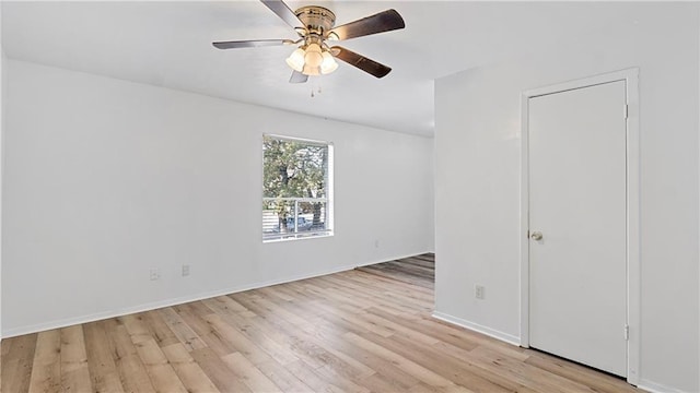 unfurnished bedroom with ceiling fan and light wood-type flooring