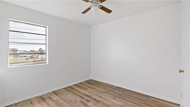 unfurnished room with ceiling fan and light wood-type flooring