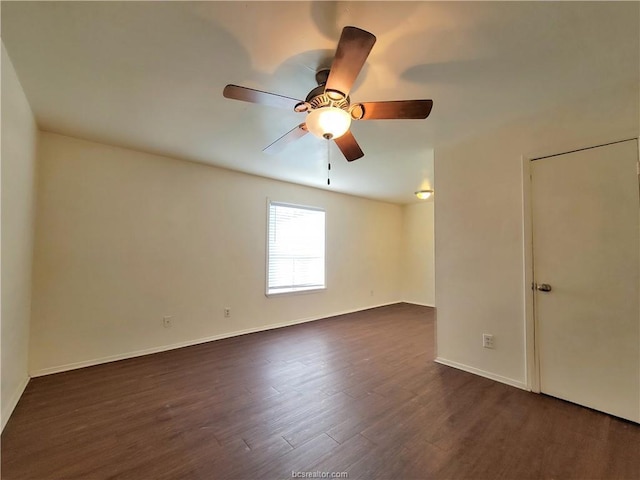 unfurnished room featuring dark hardwood / wood-style floors and ceiling fan