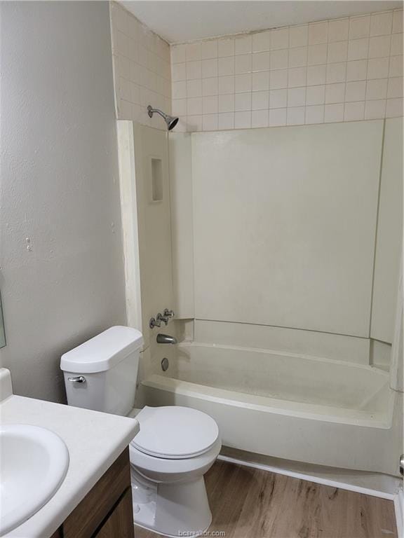 full bathroom featuring shower / bathtub combination, vanity, toilet, and hardwood / wood-style floors