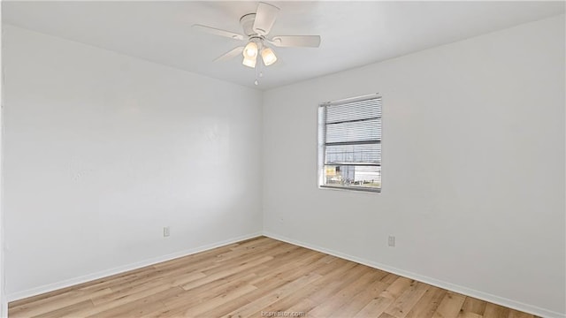 spare room featuring ceiling fan and light hardwood / wood-style flooring