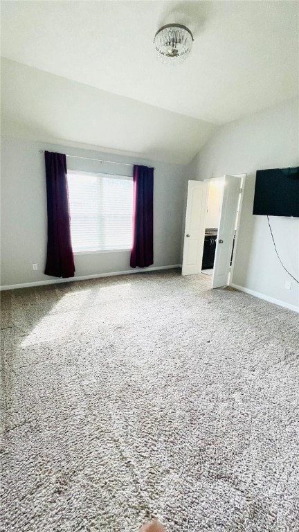 15481 Baker Meadow Loop, College Station, TX 77845 - unfurnished living room with vaulted ceiling, baseboards, and carpet floors