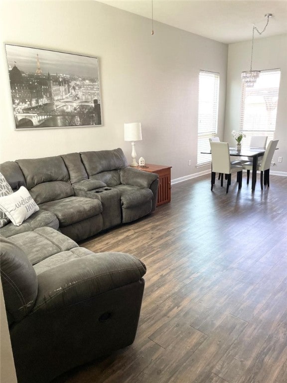 15481 Baker Meadow Loop, College Station, TX 77845 - living room with dark wood-style flooring, baseboards, and a chandelier