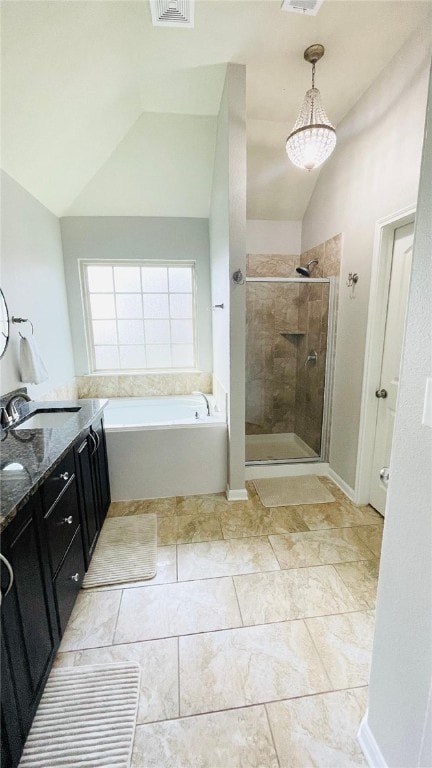 15481 Baker Meadow Loop, College Station, TX 77845 - bathroom with lofted ceiling, a shower stall, a garden tub, and vanity