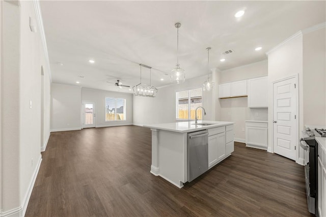 kitchen featuring white cabinets, sink, an island with sink, appliances with stainless steel finishes, and dark hardwood / wood-style flooring