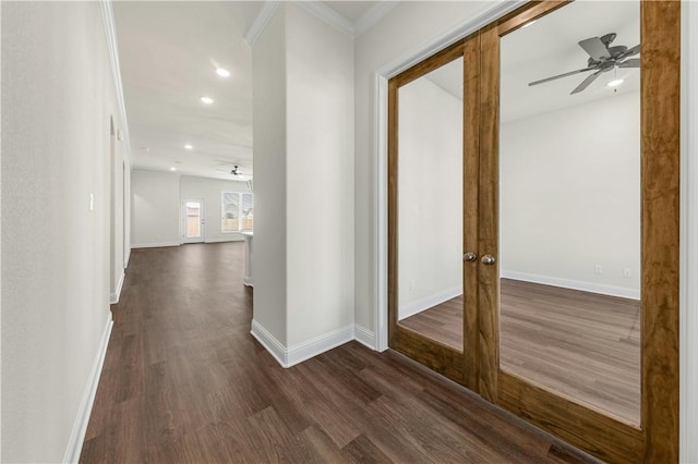 hallway with crown molding, dark wood-type flooring, and french doors