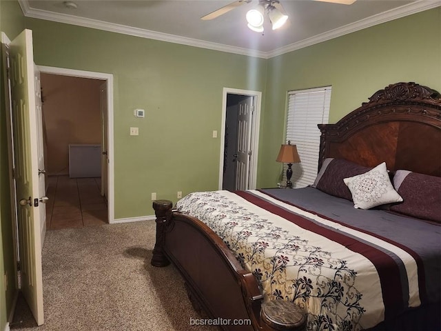 carpeted bedroom featuring ceiling fan and crown molding