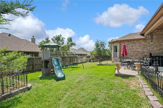 4314 Hadleigh Ln, College Station, TX 77845 - view of yard featuring a patio area and a playground