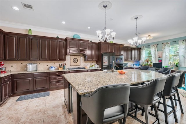 4314 Hadleigh Ln, College Station, TX 77845 - kitchen featuring a chandelier, a sink, crown molding, stainless steel appliances, and decorative backsplash