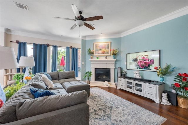 4314 Hadleigh Ln, College Station, TX 77845 - living area featuring a ceiling fan, a glass covered fireplace, crown molding, and dark wood-style floors