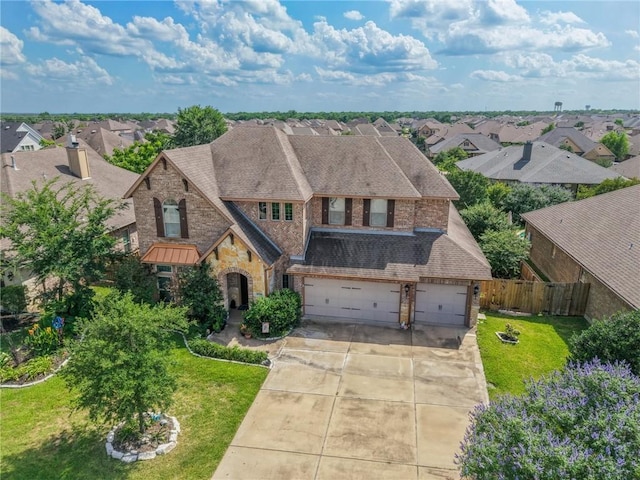 4314 Hadleigh Ln, College Station, TX 77845 - view of front of house featuring stone siding, driveway, a residential view, and roof with shingles
