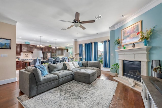 4314 Hadleigh Ln, College Station, TX 77845 - living room with a ceiling fan, ornamental molding, dark wood-style flooring, baseboards, and a glass covered fireplace