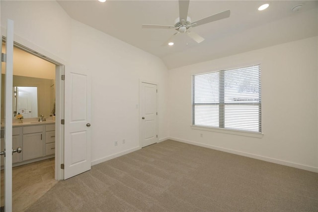 2784 Messenger Way, Bryan, TX 77803 - unfurnished bedroom featuring light colored carpet, vaulted ceiling, recessed lighting, baseboards, and connected bathroom