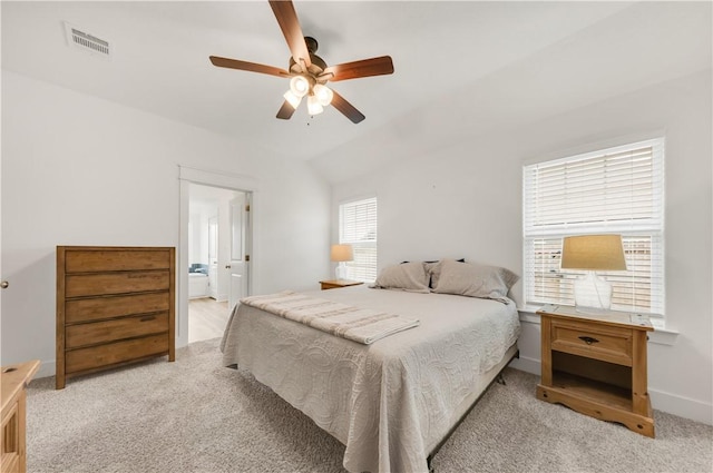 bedroom featuring ceiling fan, light carpet, baseboards, vaulted ceiling, and visible vents