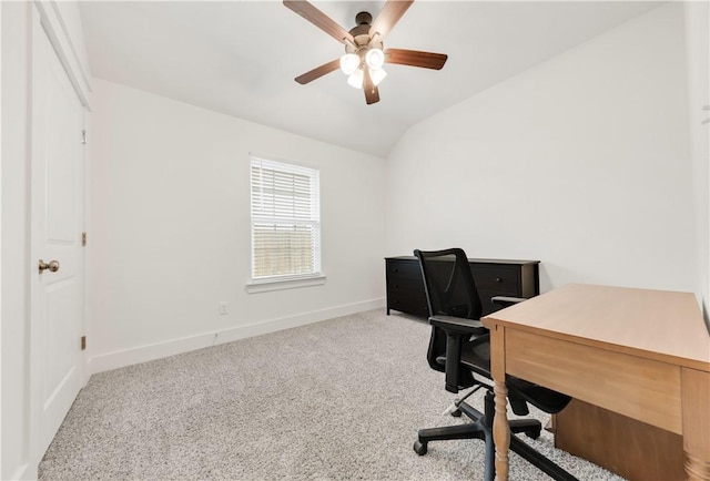 carpeted office with baseboards, vaulted ceiling, and ceiling fan