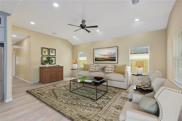 living room with ceiling fan and lofted ceiling