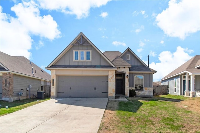 craftsman house featuring board and batten siding, a garage, cooling unit, driveway, and a front lawn