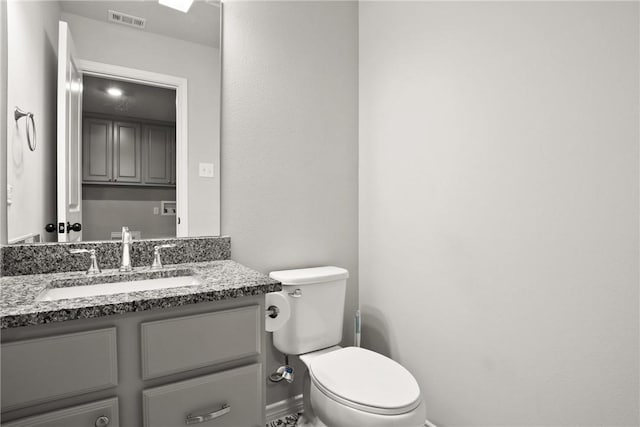10008 Henley Cv, Iola, TX 77861 - half bath with toilet, vanity, and baseboards