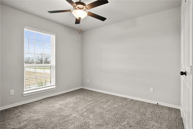 10008 Henley Cv, Iola, TX 77861 - empty room featuring plenty of natural light, carpet floors, baseboards, and a ceiling fan
