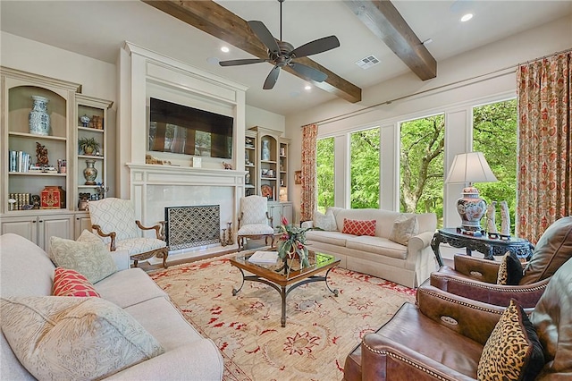 5205 Bourrone Ct, Bryan, TX 77802 - living room with plenty of natural light, ceiling fan, beamed ceiling, a high end fireplace, and recessed lighting