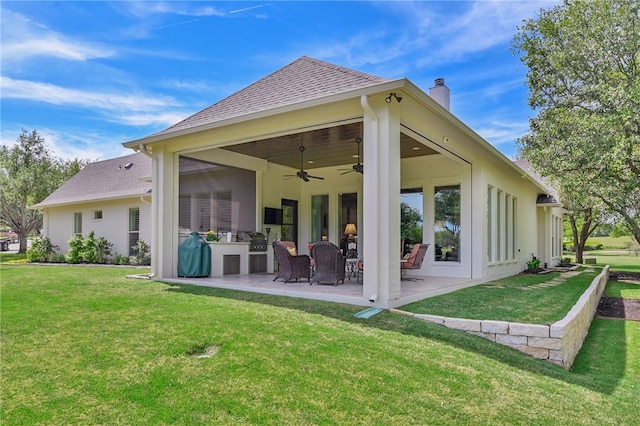 5205 Bourrone Ct, Bryan, TX 77802 - rear view of house featuring a chimney, ceiling fan, a lawn, and a patio