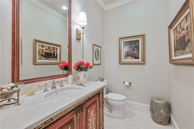5205 Bourrone Ct, Bryan, TX 77802 - bathroom with vanity, crown molding, toilet, and baseboards