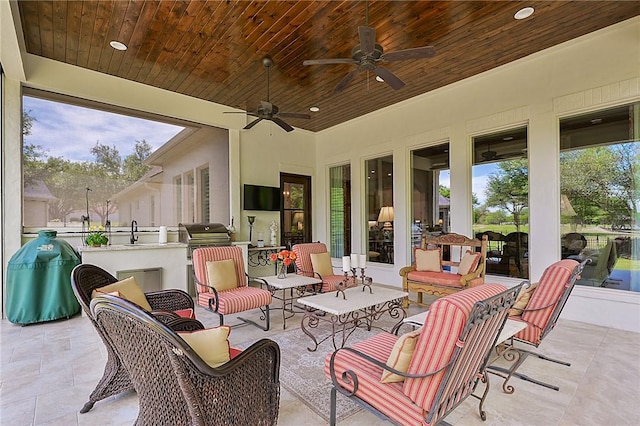 5205 Bourrone Ct, Bryan, TX 77802 - view of patio / terrace featuring an outdoor kitchen, outdoor lounge area, and a ceiling fan