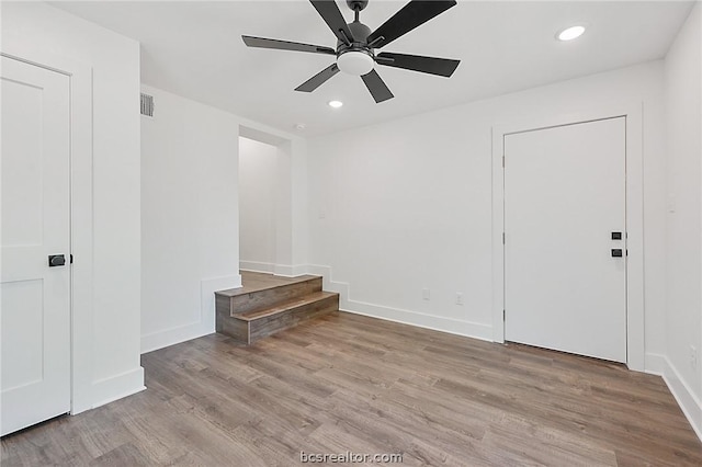 interior space featuring light hardwood / wood-style flooring and ceiling fan