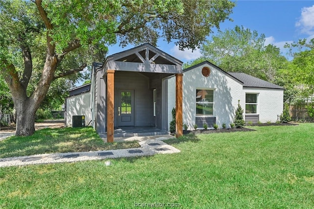 contemporary home with cooling unit and a front lawn