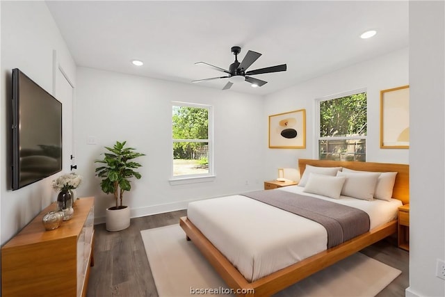 bedroom featuring ceiling fan and dark hardwood / wood-style floors