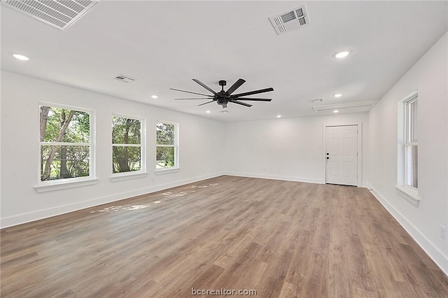 unfurnished room featuring hardwood / wood-style flooring and ceiling fan