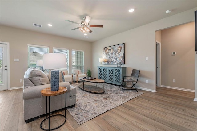 6409 Raleigh Loop, College Station, TX 77845 - living room with wood finished floors, a ceiling fan, baseboards, and recessed lighting