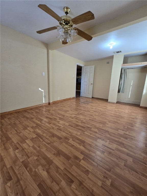 unfurnished living room with hardwood / wood-style floors and ceiling fan