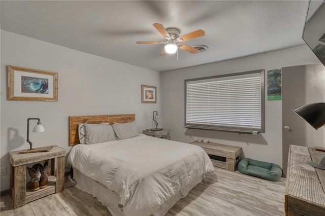 bedroom featuring ceiling fan and light hardwood / wood-style flooring