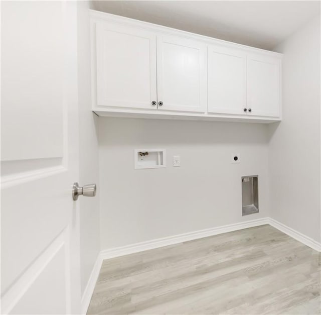 301 S Hutchins St, Bryan, TX 77803 - washroom featuring light wood-type flooring, washer hookup, cabinet space, baseboards, and hookup for an electric dryer