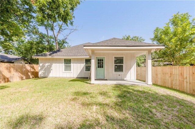 301 S Hutchins St, Bryan, TX 77803 - rear view of property featuring a patio area, a shingled roof, and board and batten siding