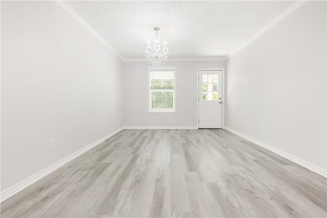 301 S Hutchins St, Bryan, TX 77803 - unfurnished dining area with a chandelier, light wood-style floors, crown molding, and baseboards