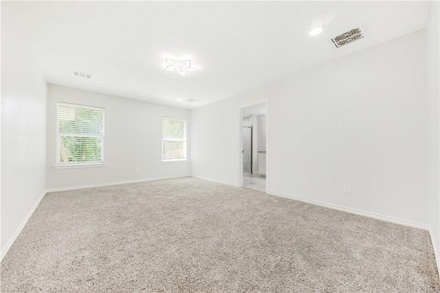 301 S Hutchins St, Bryan, TX 77803 - unfurnished room with carpet floors and baseboards