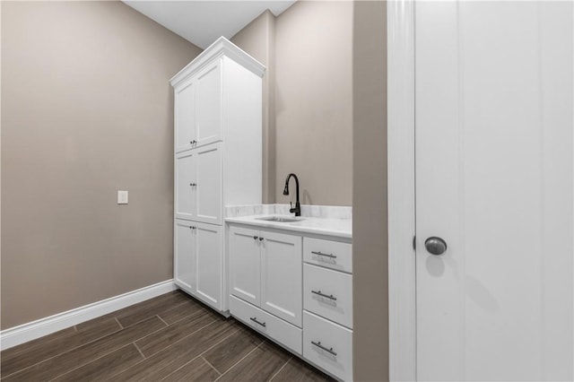 bathroom with hardwood / wood-style floors and vanity