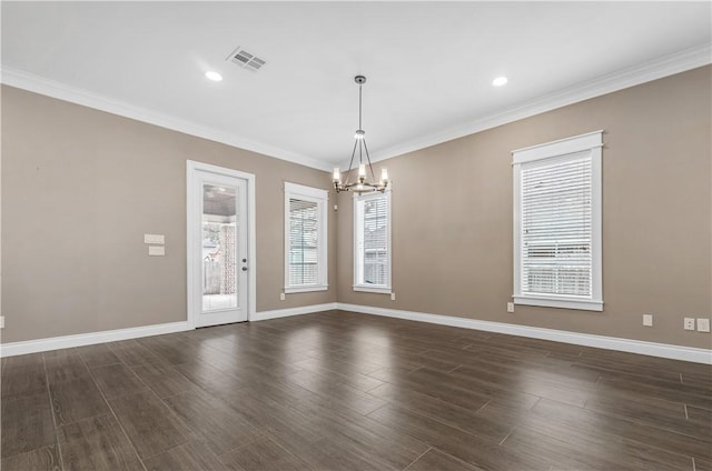 interior space featuring dark hardwood / wood-style flooring, plenty of natural light, ornamental molding, and a notable chandelier