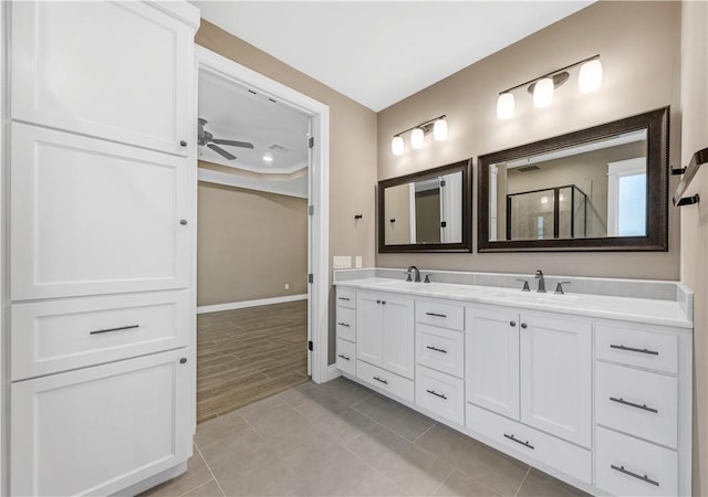 bathroom featuring vanity, hardwood / wood-style flooring, and ceiling fan