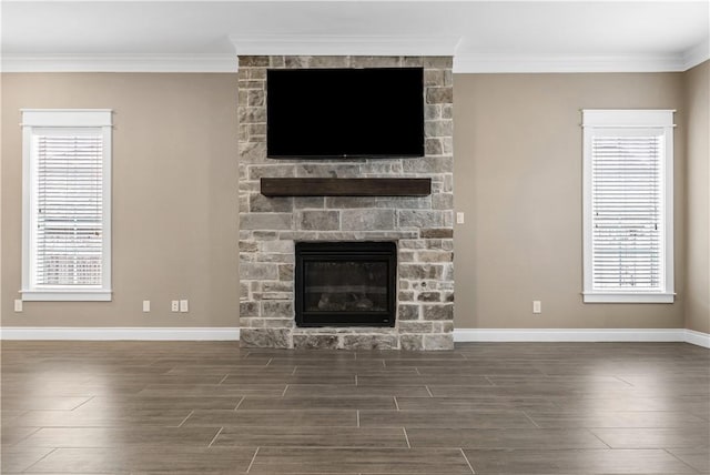 unfurnished living room featuring a fireplace, dark hardwood / wood-style flooring, and plenty of natural light