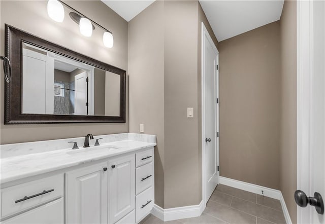 bathroom with tile patterned floors and vanity