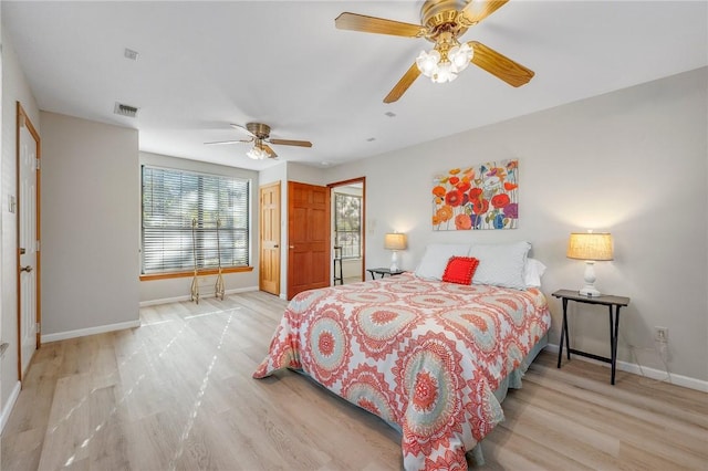 bedroom with light hardwood / wood-style floors and ceiling fan