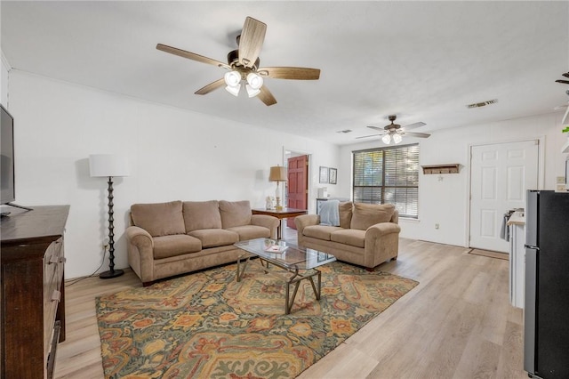 living room with light hardwood / wood-style floors