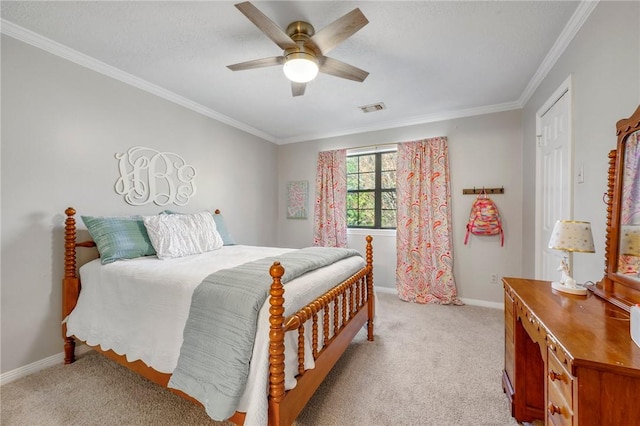 carpeted bedroom featuring ceiling fan and ornamental molding