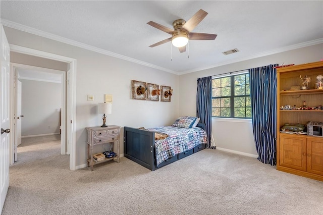 bedroom featuring ceiling fan, crown molding, and light carpet